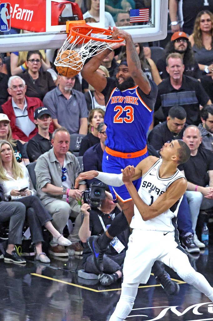 Mitchell Robinson dunks over Victor Wembanyama in Game 2.