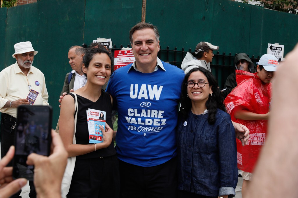 State Sen. Michael Gianaris wears a UAW shirt in support of congressional candidate Claire Valdez while she campaigned in Sunnyside on Democratic primary day,