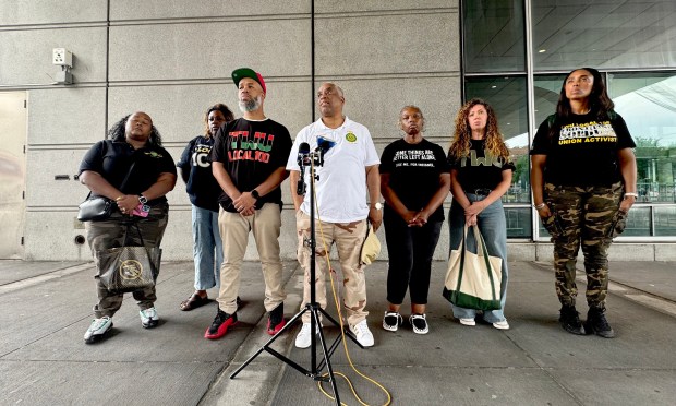 Members of the TWU LOCAL 100 Union speak to the media outside Bronx criminal court after attending the trial of Isaiah Thompson on Friday.