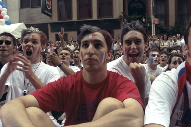 French soccer fans watch their team in the World Cup final on East 60th St. in Manhattan, New York on July 12, 1998.