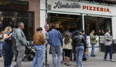 In New York, waiting in line becomes a social scene
