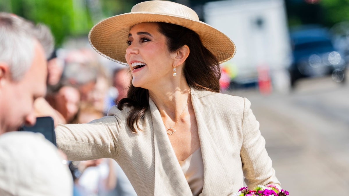 Queen Mary turns a silk scarf and a single rose into the ultimate royal beauty statement