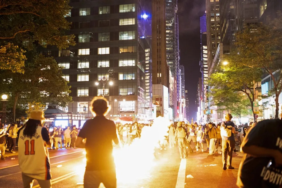 A rowdy crowd ignites a fire in the streets near Bryant Park after the Knicks win on June 13, 2026. REUTERS