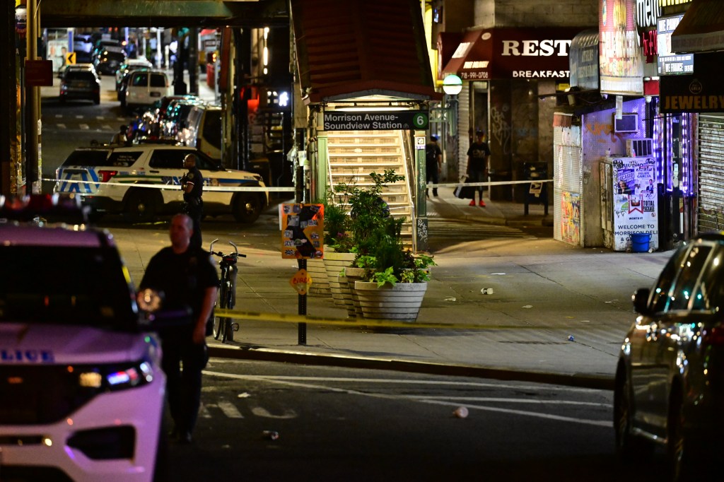 Police officers investigating a shooting on Westchester Avenue in the Bronx.