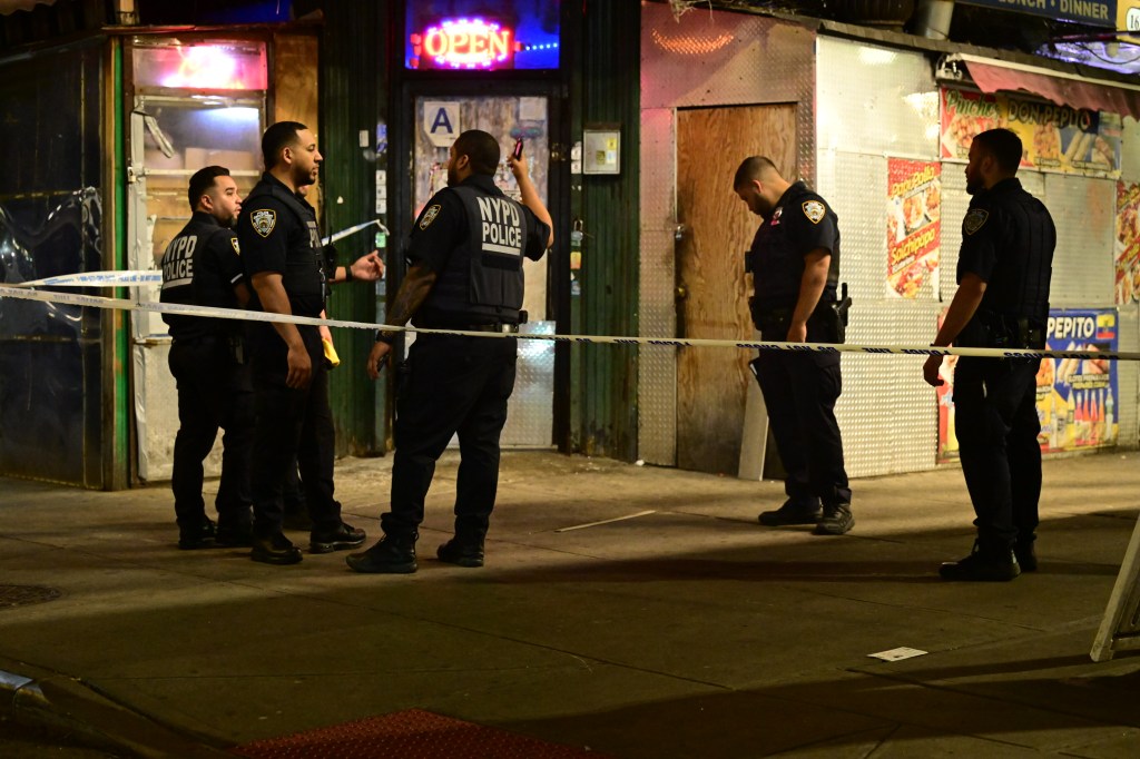 NYPD officers at a crime scene on Westchester Avenue in the Bronx.