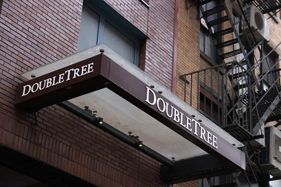 Signage is seen outside of a DoubleTree by Hilton hotel in Manhattan, New York City, U.S., March 23, 2022.