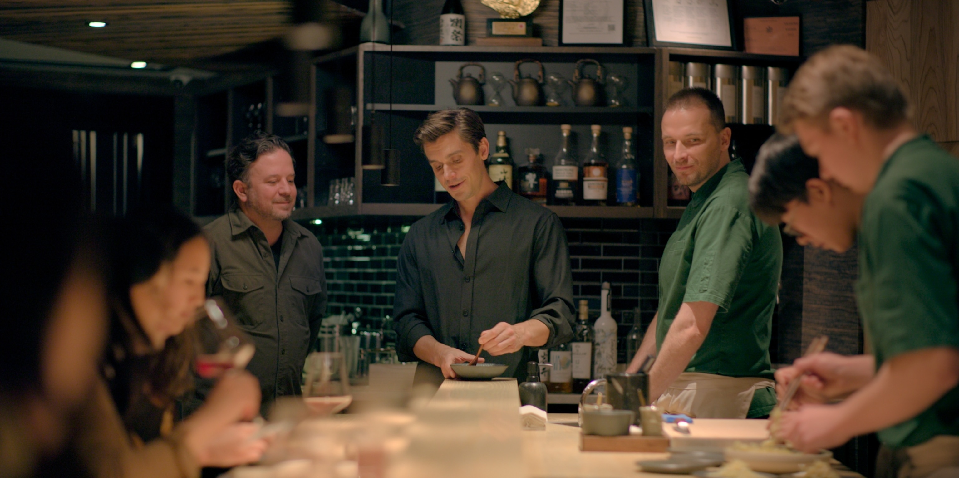 Antoni Porowski assists with the service at Ikigai.