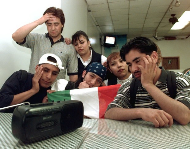 Mexico soccer fans listen to their teamÕs World Cup game against Germany on a radio at the Los Dos Rancheros Restaurant on Ninth Avenue in Manhattan on June 29, 1998.