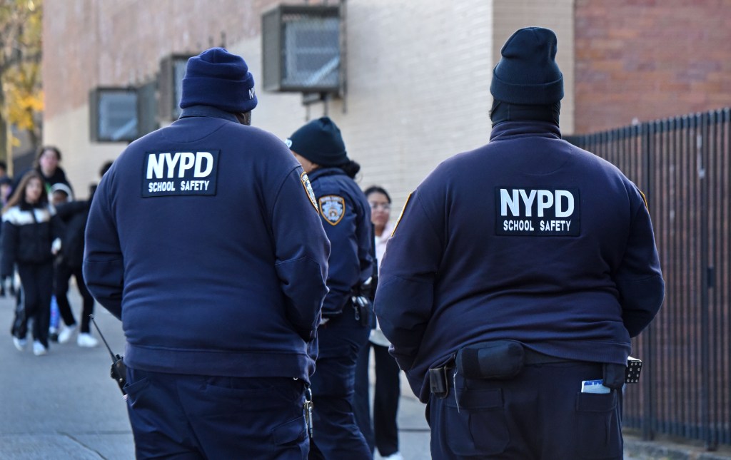 SCHOOL SAFETY AGENTS SEEN FROM BEHIND