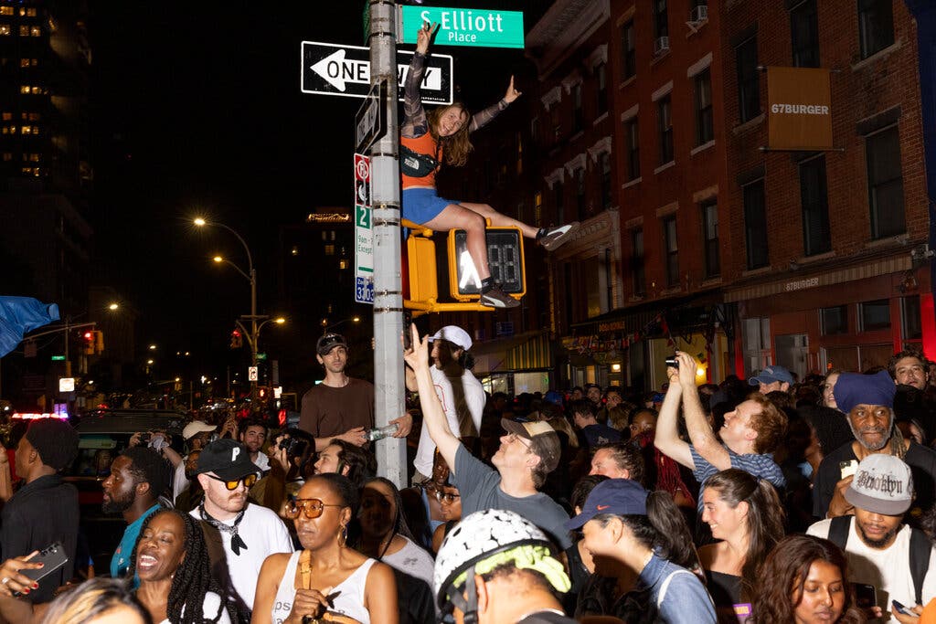 Crowds celebrated the New York Knicks Game 5 win in Brooklyn on Saturday.