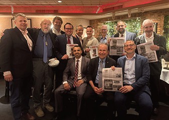Several of the members proudly dis­playing the article in the Western Queens Gazette that the group ap­peared in the prior month.