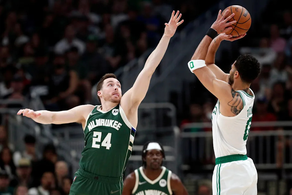 May 13, 2022; Milwaukee, Wisconsin, USA; Milwaukee Bucks guard Pat Connaughton (24) defends Boston Celtics forward Jayson Tatum (0) during the second quarter during game six of the second round for the 2022 NBA playoffs at Fiserv Forum. Mandatory Credit: Jeff Hanisch-USA TODAY Sports