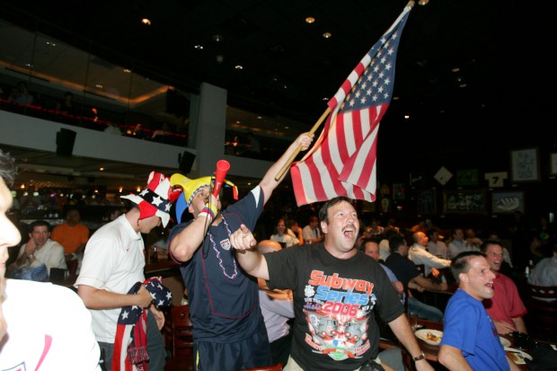 USA soccer fans go wild at ESPN Zone in Times Square after their team scored a goal against Ghana in the 2006 World Cup on June 22, 2006.