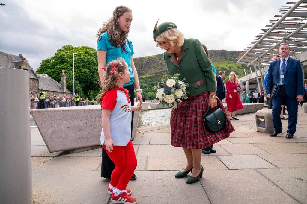 A photo of Queen Camilla and a little girl