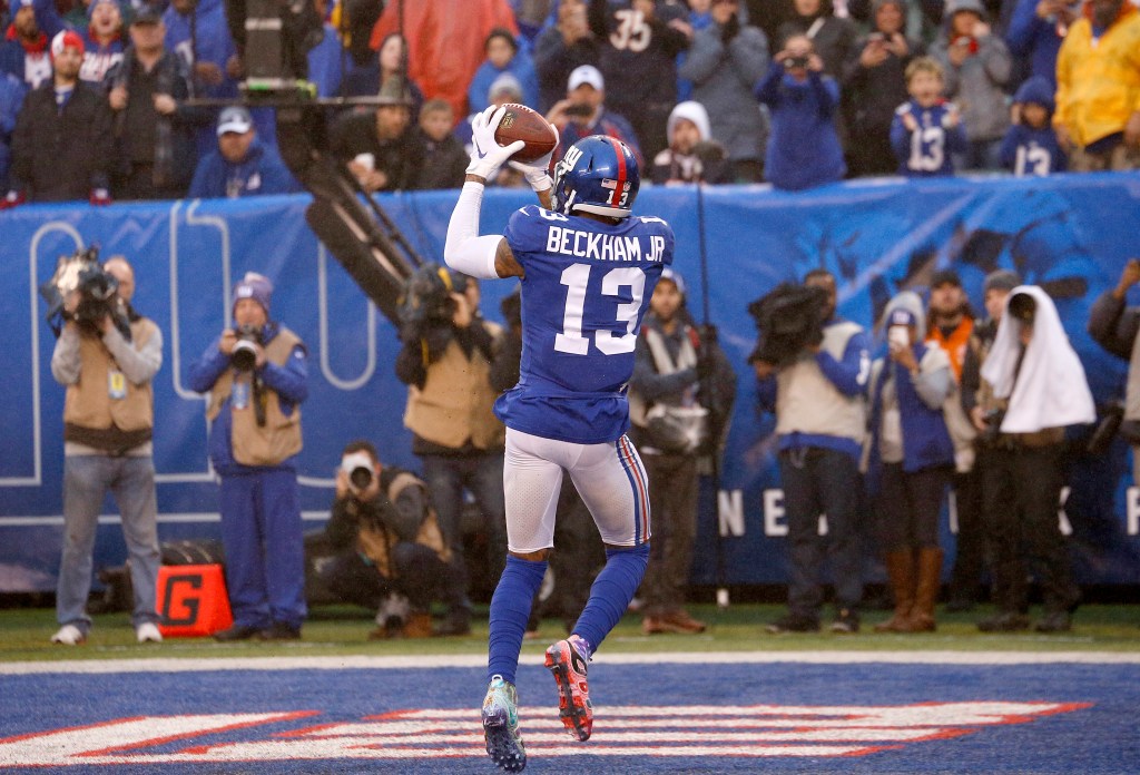 Odell Beckham Jr. catching a football during a New York Giants game.
