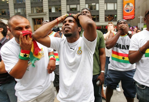 Ghanaian soccer fans gather in Times Square to watch their team take on the USA in the 2006 World Cup on June 22, 2006.