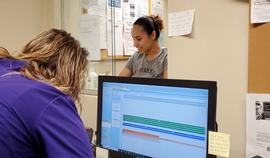 Patient checking in for appointment at Manhattan Free Clinic.
