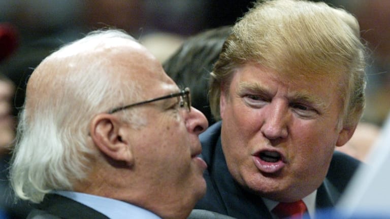 Donald Trump, right, talks to an unidentified man from the...