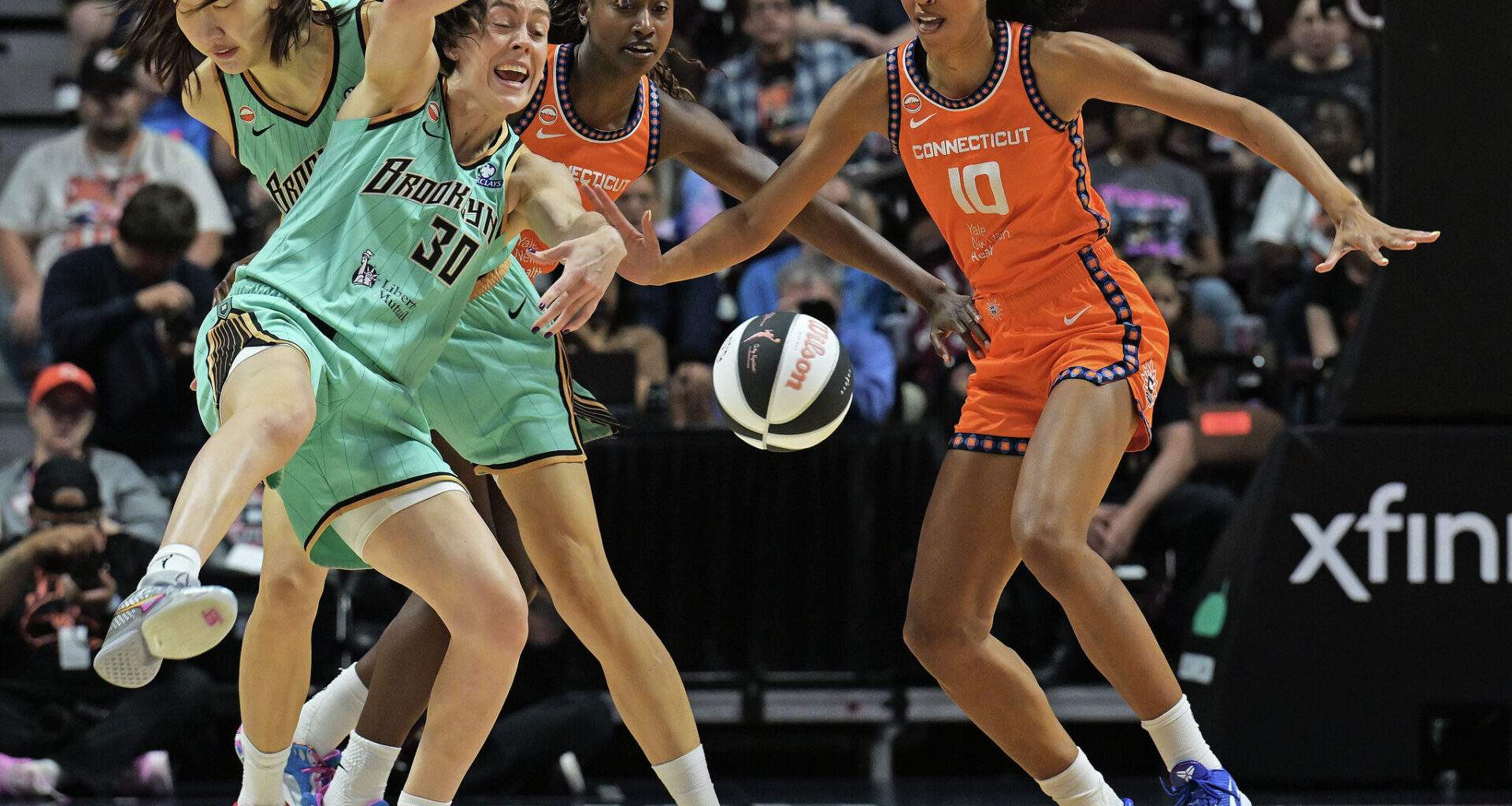 Breanna Stewart #30 of the New York Liberty loses the ball as she is fouled by Diamond Miller #1 of the Connecticut Sun (back) in the first quarter at Mohegan Sun Arena on June 8, 2026 in Uncasville, Connecticut.