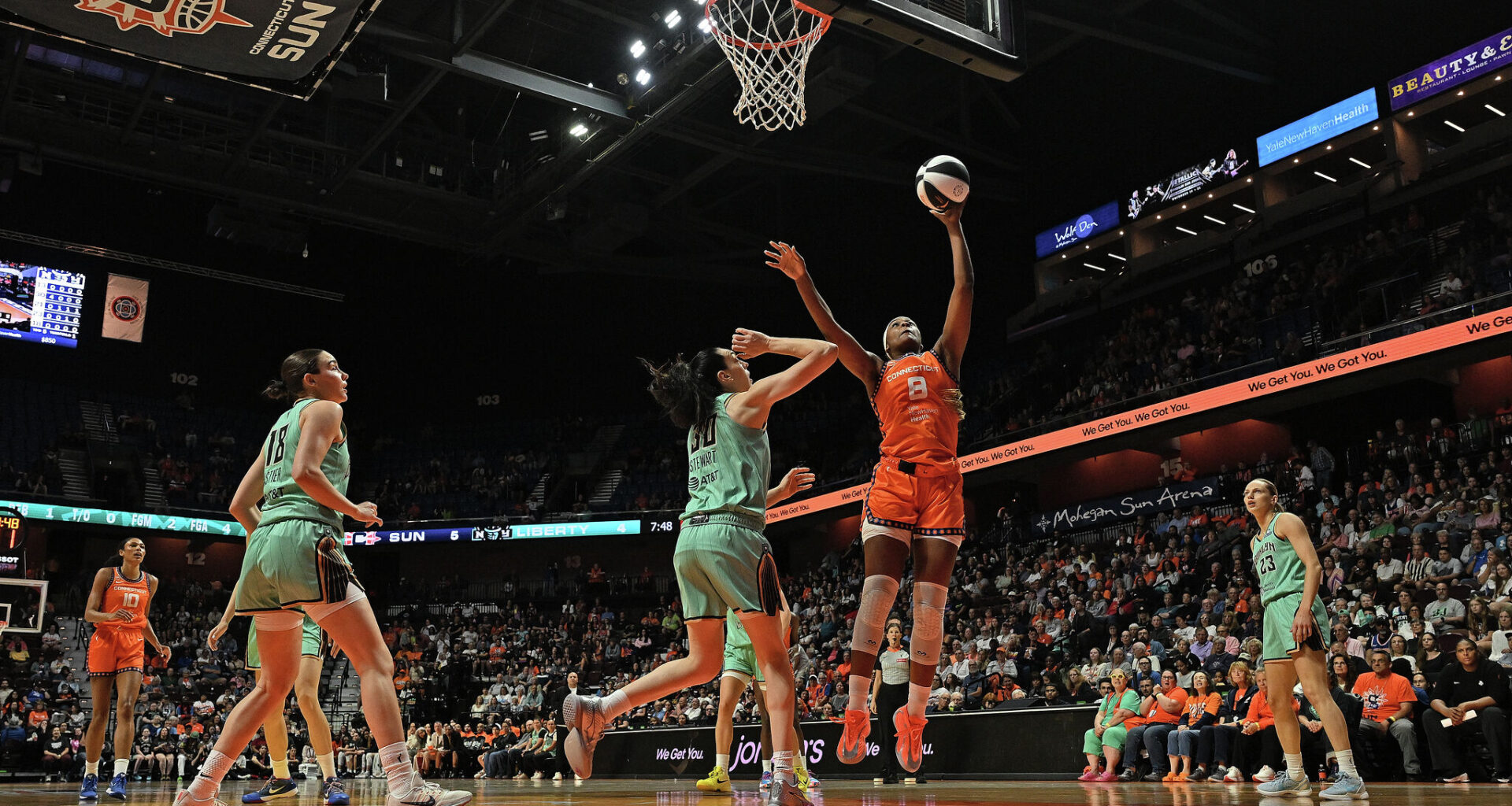 Aaliyah Edwards #8 of the Connecticut Sun scores over Breanna Stewart #30 of the New York Liberty in the first quarter at Mohegan Sun Arena on June 8, 2026 in Uncasville, Connecticut.
