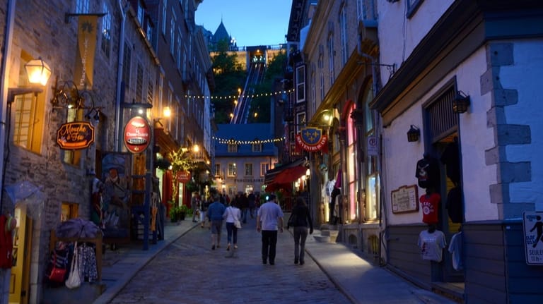 People stroll the cobblestoned streets of Quebec.