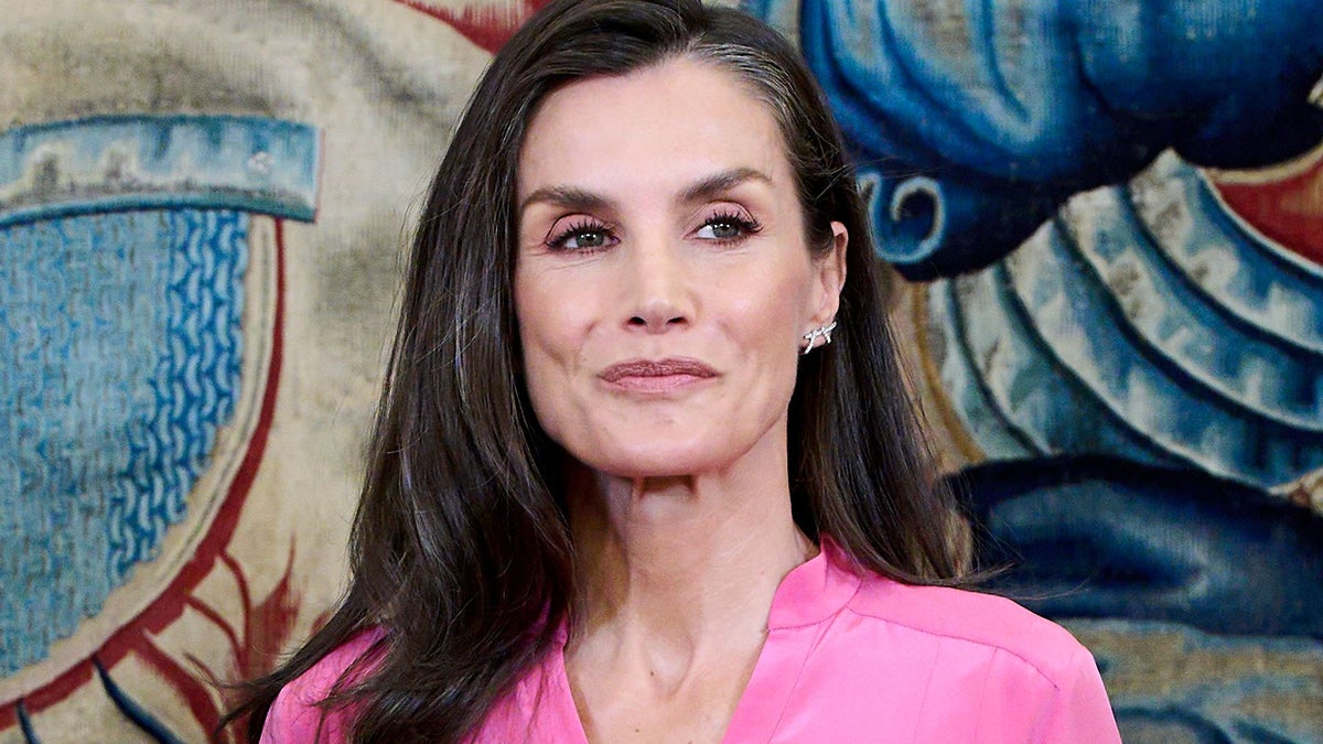 Queen Letizia swaps her papal white looks for a striking oversized pink dress and Spanish espadrilles