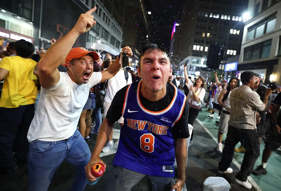 New York Knicks fans celebrate outside Madison Square Garden after their team's Game 4 victory over the San Antonio Spurs in the NBA Finals in New York City on June 10, 2026.