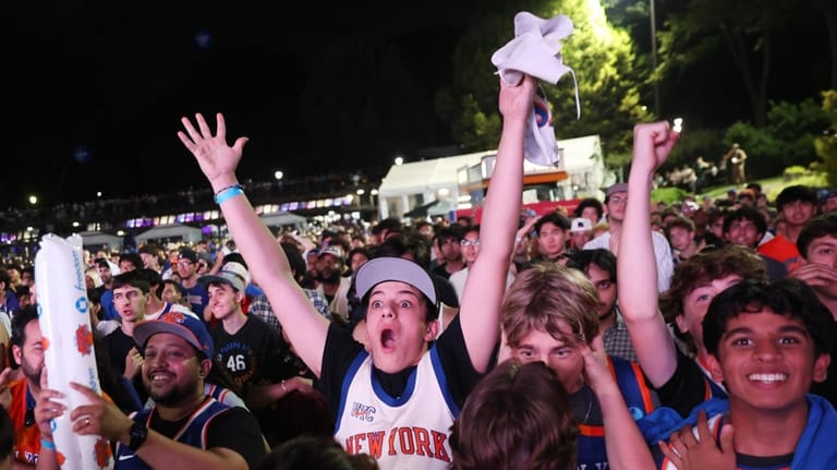 New York Knicks fans react during a watch party inside...