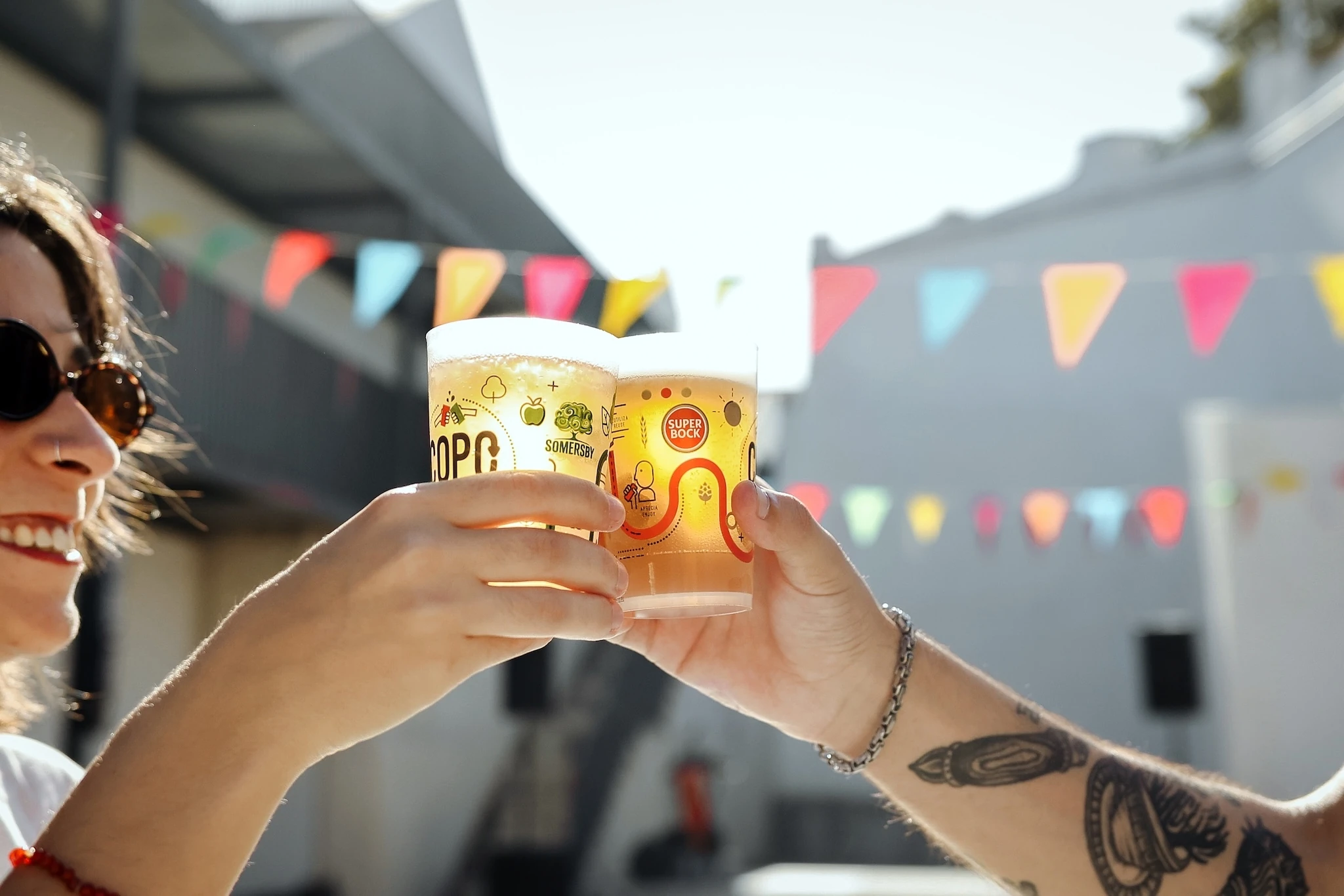 Two hands cheersing with beers