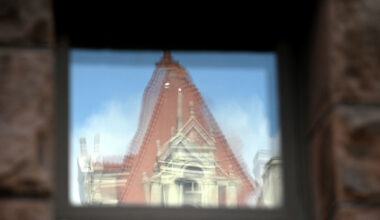 The Capitol is reflected in a window at Albany City Hall on June 1, 2026.