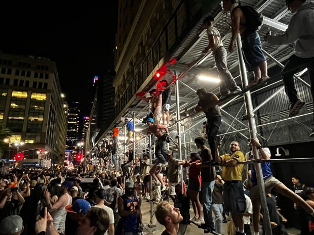 New York Knicks fans celebrate their team's NBA championship near Greeley Square in Manhattan early Sunday, June 14, 2026. (Julian Roberts-Grmela / New York Daily News)