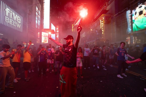 New York Knicks fans celebrate in Times Square after the Knicks defeated the San Antonio Spurs in the NBA Finals on Saturday, June 13, 2026 in Manhattan, New York. (Barry Williams/ New York Daily News)