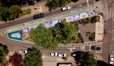 NYC DOT's recently completed art mural at Father Studzinski Square, delivered as part of the redesign of McGuinness Boulevard, which brought expanded painted pedestrian space and a barrier-protected bike lane along the Brooklyn street. Photo credit: Ben Wolf