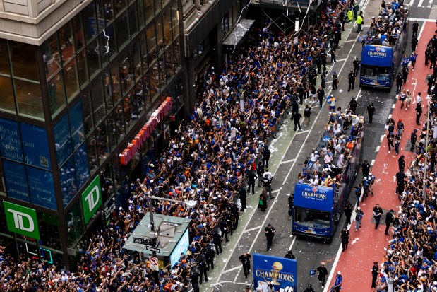 Fans cheer during the New York Knicks Championship ticker tape parade and victory rally celebrating winning the 2026 NBA Finals on June 18, 2026 in New York City.