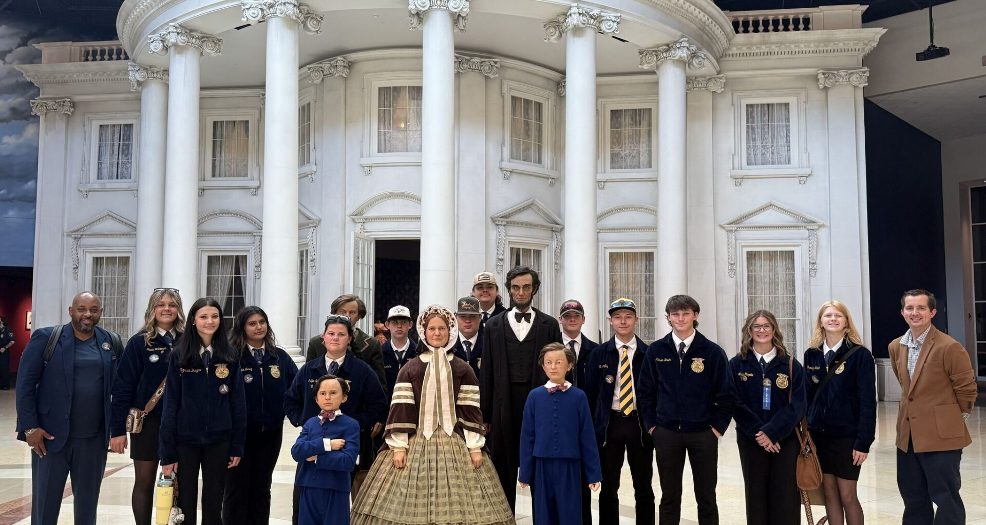 Edwardsville FFA members with Lincoln family statues at the Abraham Lincoln Presidential Museum and Library. Left to right: Michael Hubbard, Macie Wilkinson, Elizabeth Dungan, Angie Nuñez, Caitlyn Stafford, Hunter Touchette, Dylan Henke, Lucas Wilkinson, Austin Manley, Mason Morfey, Kolson Bruhn, Lucy Heepke, Brooklyn Elliott, Joseph Birrittier