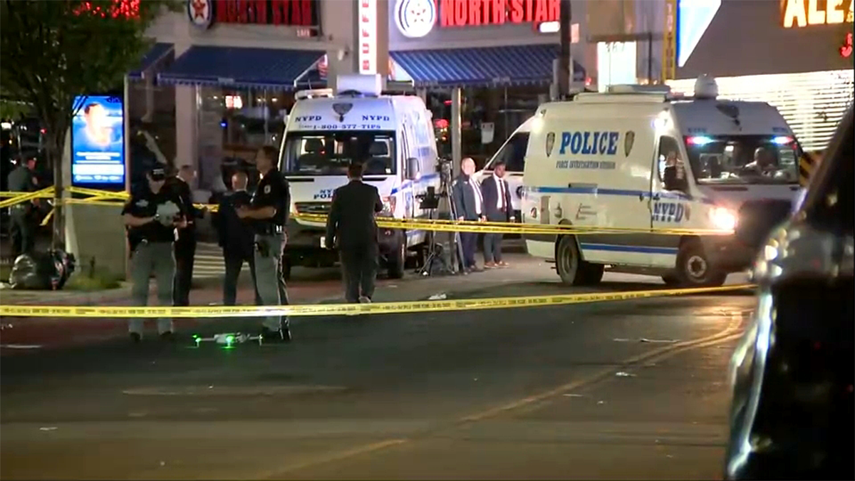 Crime scene with police and medics at NYPD-involved shooting in the Bronx