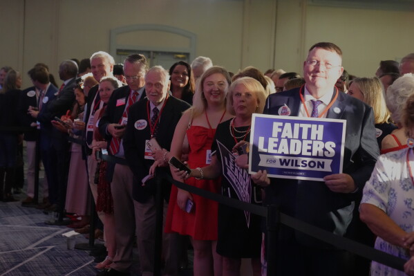 Supporters of South Carolina Attorney General Alan Wilson gather for his gubernatorial Election Night victory party, in Columbia, Tuesday, June 23, 2026. (AP Photo/Meg Kinnard)