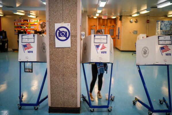 A voter casts a ballot during New York's primary election on Tuesday, June 23, 2026, in New York. (AP Photo/Ryan Murphy)
