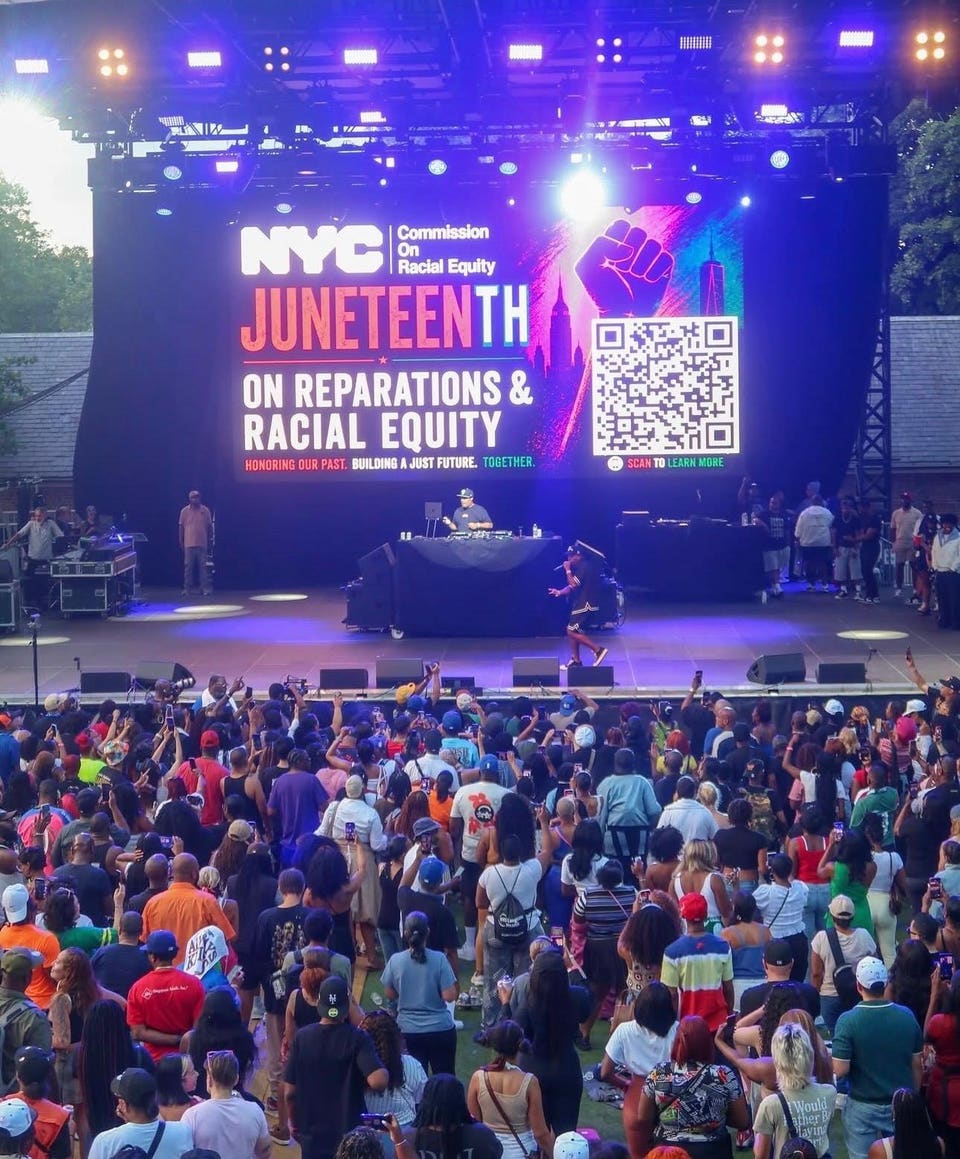 Photo of thousands of people at a concert for reparations on Juneteenth. 