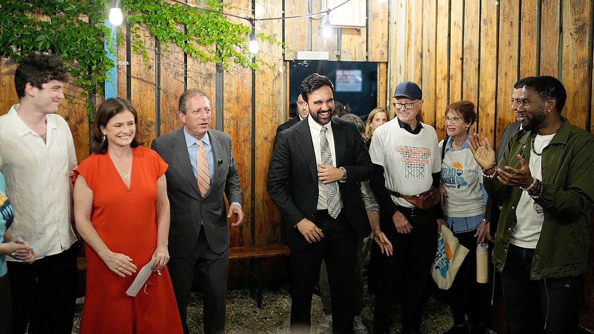 Brad Lander and Zohran Mamdani standing together at a watch party in Brooklyn