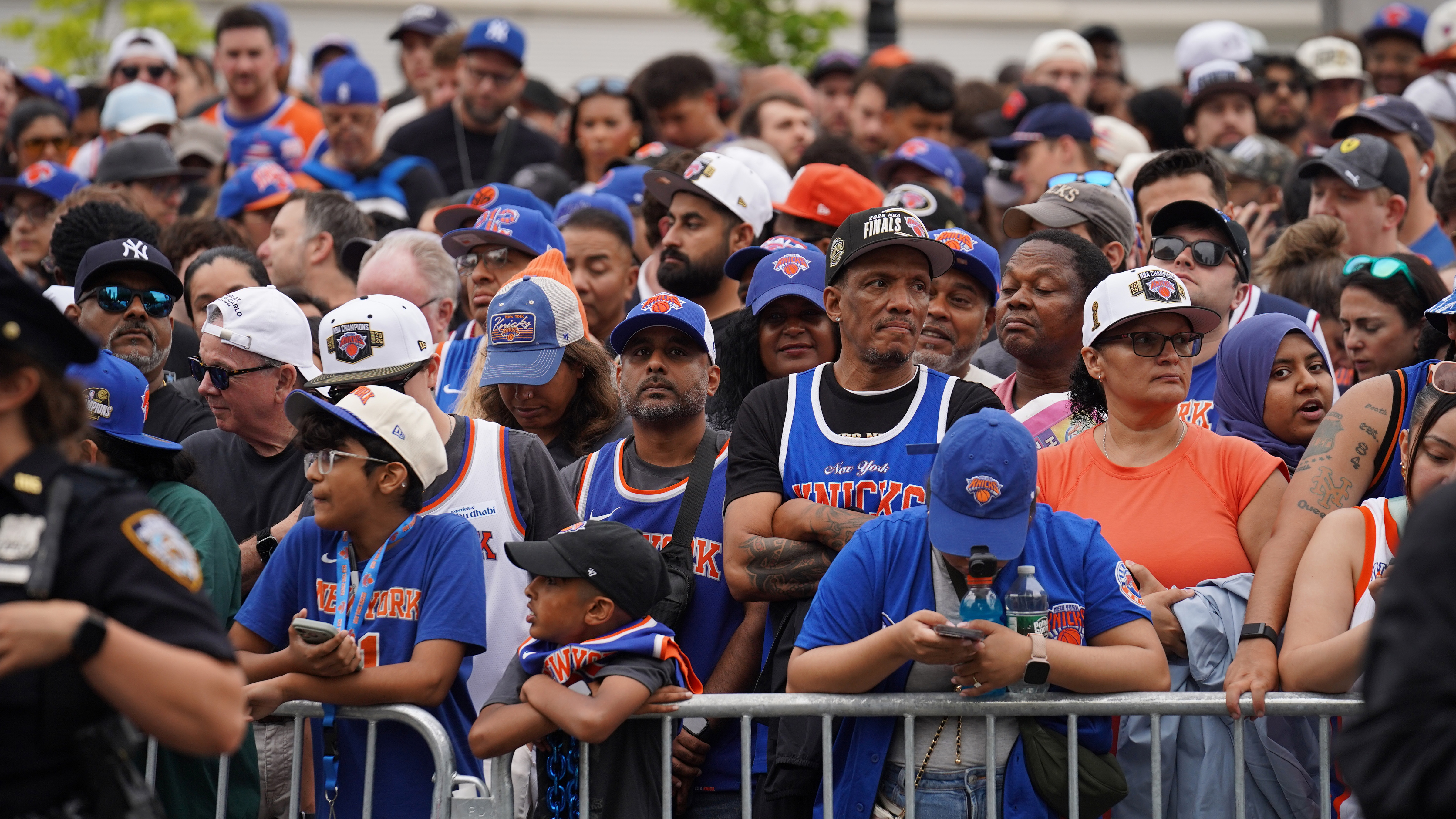 Fans line up along the route before the New York Knicks' NBA championship parade Thursday, June 18, 2026, in New York. 