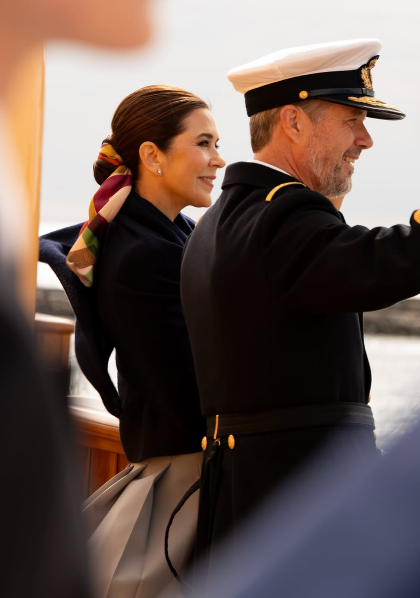 The Danish queen debuted her now-viral silk scarf bun in Grenaa, pairing the chic hairstyle with a sophisticated yacht-inspired ensemble.