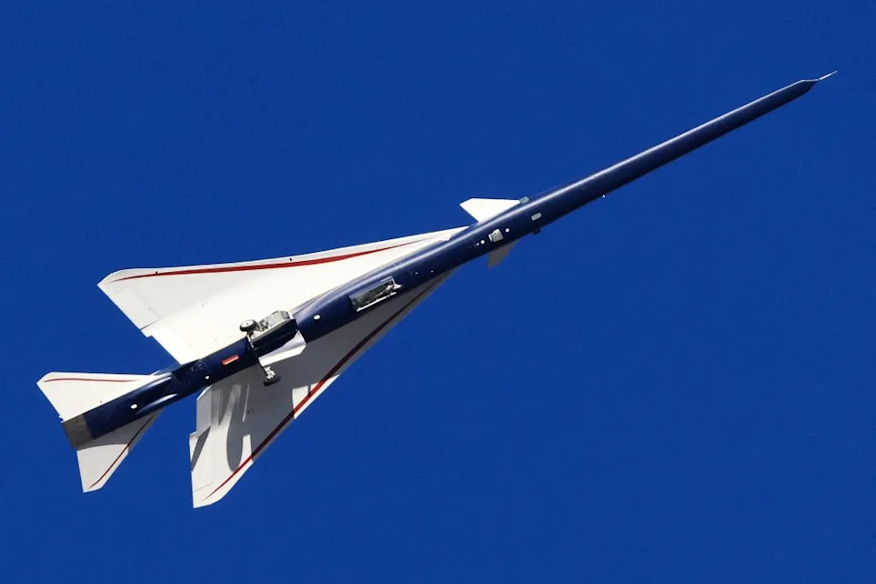 The X-59 Quesst aircraft, a quiet supersonic jet, flying in a blue sky. REUTERS