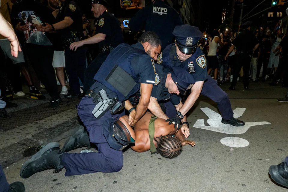 New York Knicks fans celebrate in Times Square as they win Game 4 of the NBA Finals between New York Knicks and San Antonio Spurs, on June 10, 2026 in New York City.