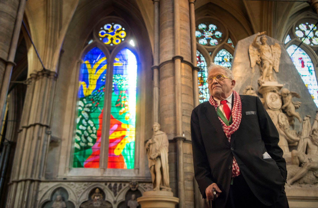 FILE PHOTO: British artist David Hockney poses in front of The Queen's Window, a new stained glass window he has designed,...