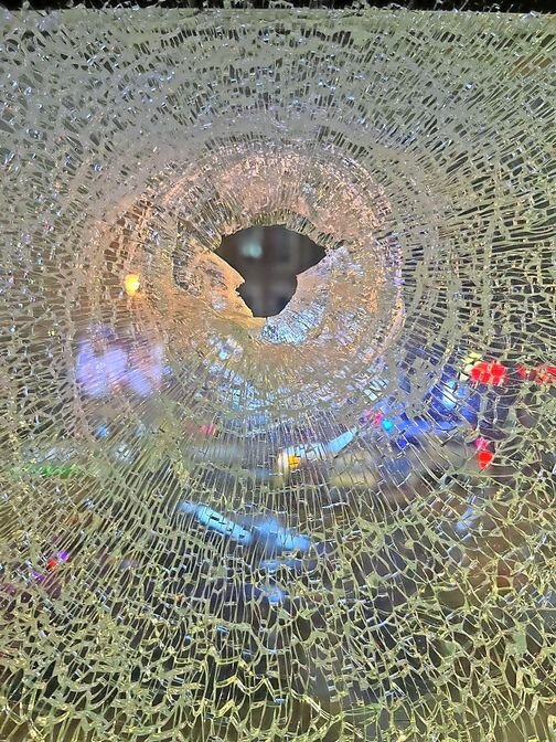 A rogue bullet from the incident went through the window of Bronx Public. No bystanders were harmed.