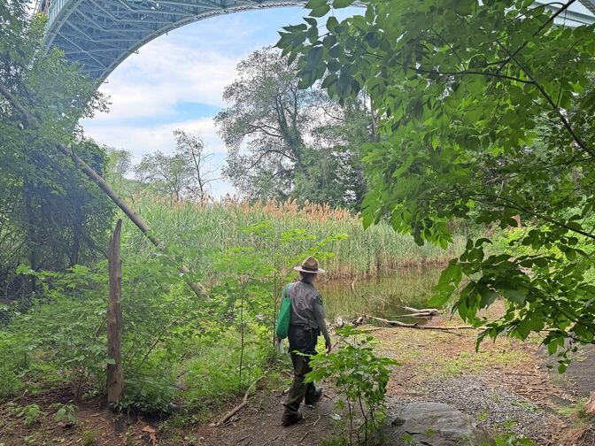 Urban Park Renger Lenora Todaro admires the view from underneath the Henry Hudson Bridge.