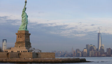 The lower Manhattan skyline, including the new One World Trade Center building at right, is viewed from near the Statue of Liberty, Jan. 31, 2014, in New York. (AP Photo/Ted S. Warren, File)