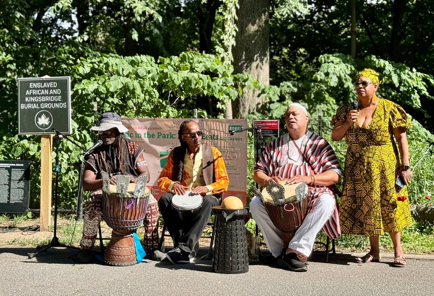 Participants gathered at the Enslaved African Burial Ground for a libation ceremony that opened the Juneteenth event. Curator Yolanda Wyns, right, restructured this year&rsquo;s program to begin at the burial ground before moving into the evening&rsquo;s musical celebration, describing the ceremony as a &ldquo;solemn&rdquo; experience that allowed attendees to reflect on the lives of the enslaved Africans who lived, worked and were buried on the former Van Cortlandt plantation. The ceremony included prayers, drumming and offerings honoring ancestors.
