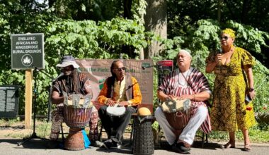 Participants gathered at the Enslaved African Burial Ground for a libation ceremony that opened the Juneteenth event. Curator Yolanda Wyns, right, restructured this year&rsquo;s program to begin at the burial ground before moving into the evening&rsquo;s musical celebration, describing the ceremony as a &ldquo;solemn&rdquo; experience that allowed attendees to reflect on the lives of the enslaved Africans who lived, worked and were buried on the former Van Cortlandt plantation. The ceremony included prayers, drumming and offerings honoring ancestors.